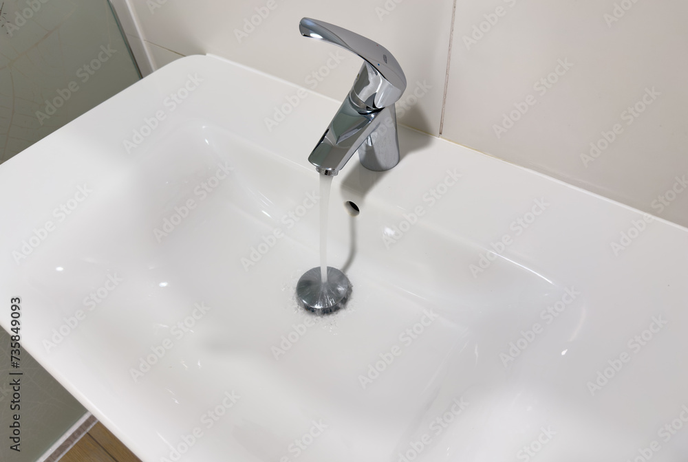 Water tap in washbasin. Bathroom faucet. Water Flowing From Faucet in Bathroom. Sink Water flowing from faucet. Saving water in sink. Wash Basin Water tap in washbasin. Bathroom faucet. Water Flowing From Faucet in Bathroom. Sink Water flowing from faucet. Saving water in sink. Wash Basin
