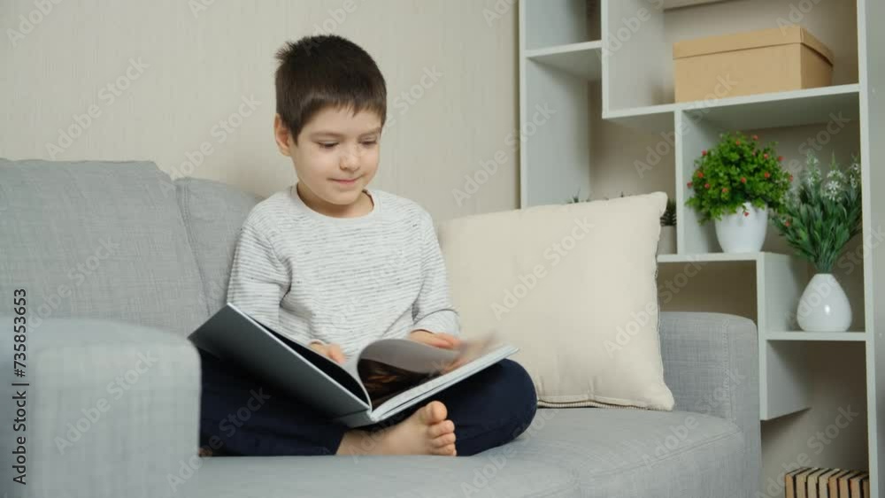 Cute 6 year old child flipping through a book, looking at pictures and learning to read. Cute 6 year old child flipping through a book, looking at pictures and learning to read.