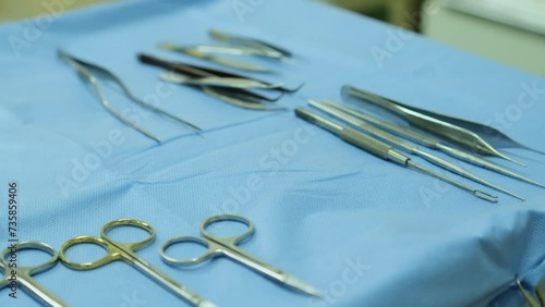 Medical instruments lie on a sterile table. Close-up photo