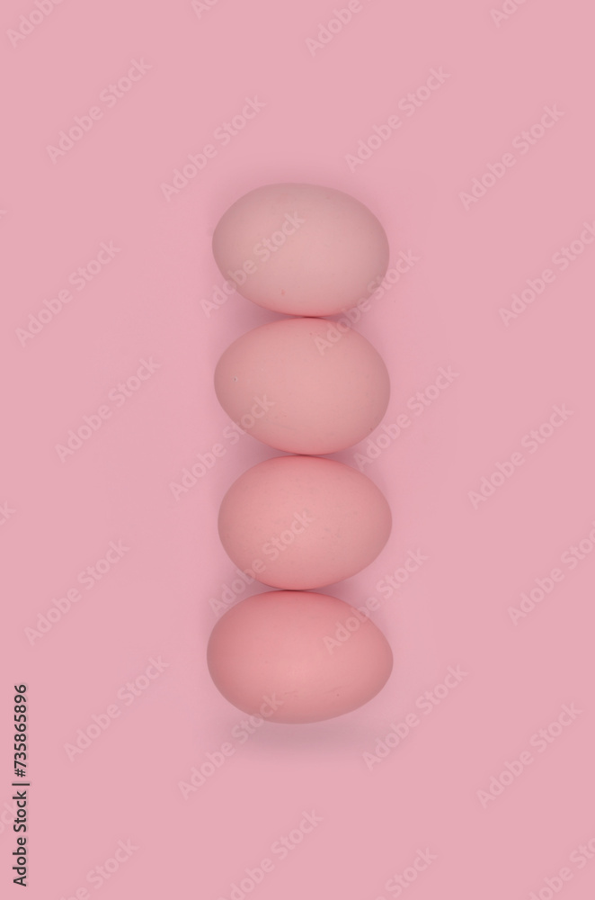Eggs tower, pink eggs and pink background - monochromatic photo, abstraction. Eggs tower, pink eggs and pink background - monochromatic photo, abstraction.