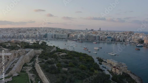 Harbour in the acient city in Malta in golden hour evening time. Aerial evening landscape