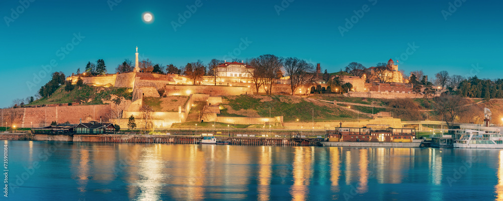 iconic Kalemegdan: A symbol of Serbia's capital, where people gather to admire the historic fortress and panoramic views at full moon at night
