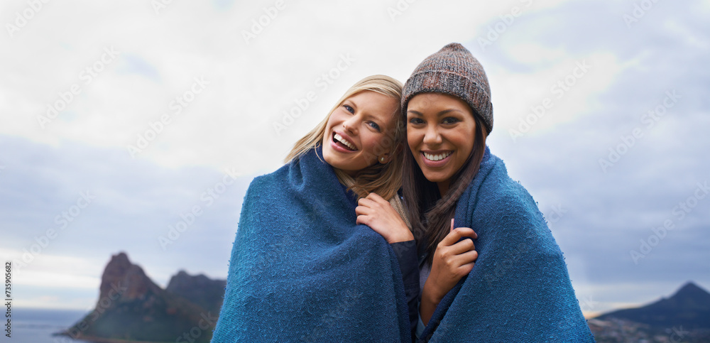 Friends, mountain and portrait of women with blanket in winter for adventure on holiday, vacation and weekend. Nature, travel and person by seaside for relaxing, happiness or bonding in countryside