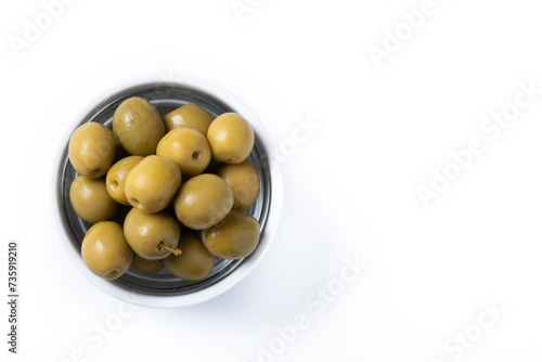 Green olives in white bowl isolated on white background. Top view. Copy space
