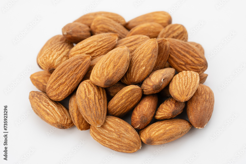 Almond nuts close up. Nut almond close up. Product rich in minerals and vitamins. Almond kernels. Texture of Almond kernels.
Almond nuts close up. Nut almond close up. Product rich in minerals and vitamins. Almond kernels. Texture of Almond kernels.