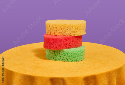 Three brightly colored shower washclothes. Skin routine in bathroom.