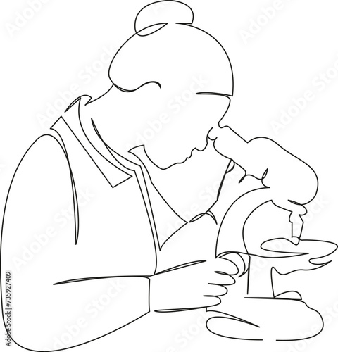 female biologist looking through a microscope