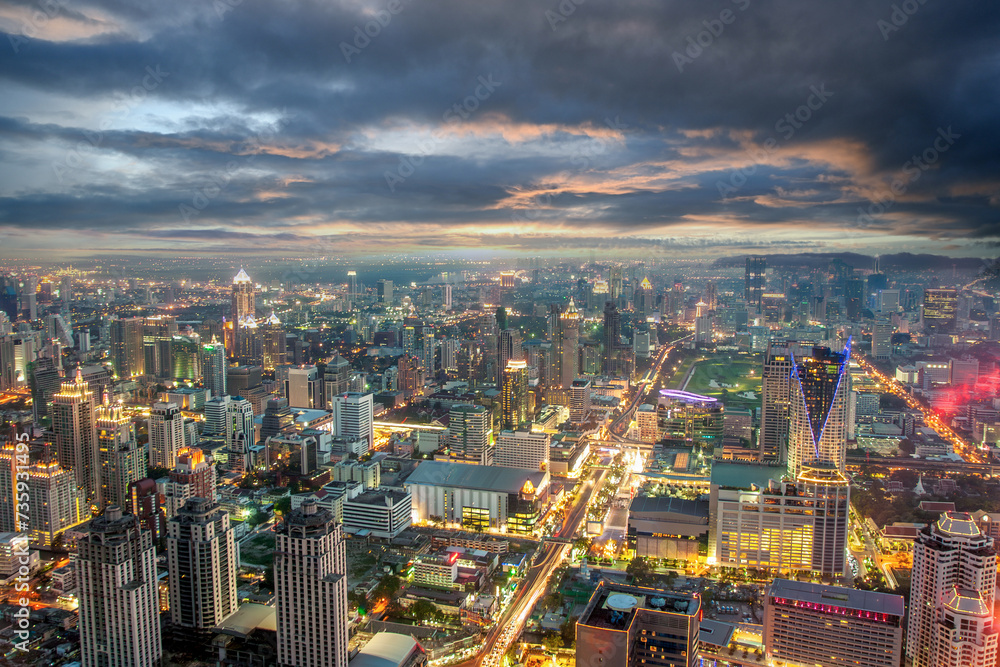 Fototapeta premium night view across Bangkok skyline with dramatic sunset sky