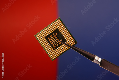 Microprocessor close-up on a red and blue background.
