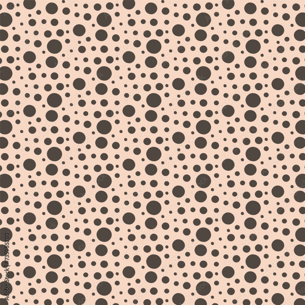 simple texture made from circles of different sizes on a beige background. simple texture made from circles of different sizes on a beige background.