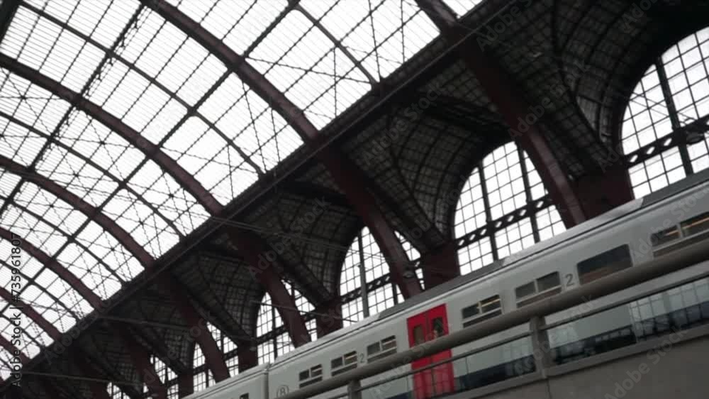 Passenger Train Departing from Antwerp Central Station in Belgium Passenger Train Departing from Antwerp Central Station in Belgium