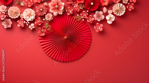 Chinese new year festival or wedding decoration over red background. Traditional lunar new year paper fans. Flat lay  top view  banner