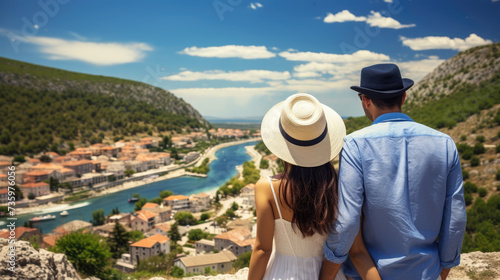 Beautiful couple admiring scenery while visiting small southern European town © brillianata