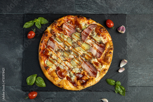 pizza menu on dark plate with stone texture