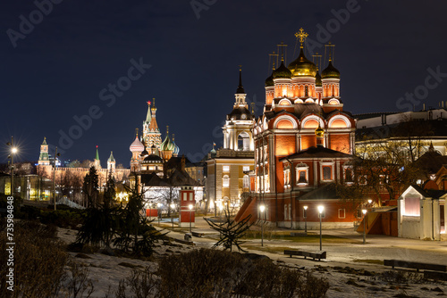 Evening view of the Znamensky Cathedral, Moscow, Russia. St. Basil's Cathedral and the Moscow Kremlin are in the distance. A beautiful church in the historical center of Moscow. Tourist attractions. photo