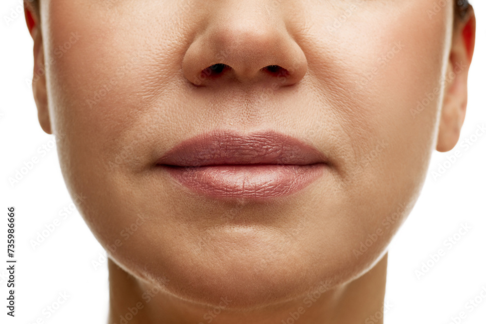 Obraz premium Cropped portrait of middle-aged woman with full moisturized pink lips with natural gloss and well-kept skin. Prevention of nasolabial folds. Concept of facial treatment, spa, cosmetology, anti-aging.