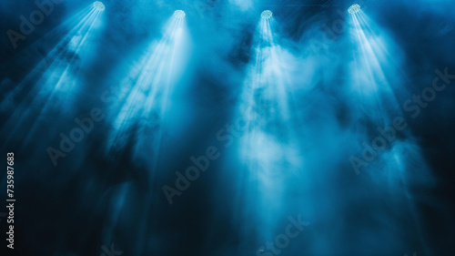 A minimalist yet powerful stage setting, with a single blue vector spotlight casting a focused beam through a subtle haze of smoke on a black background. © CtrlN