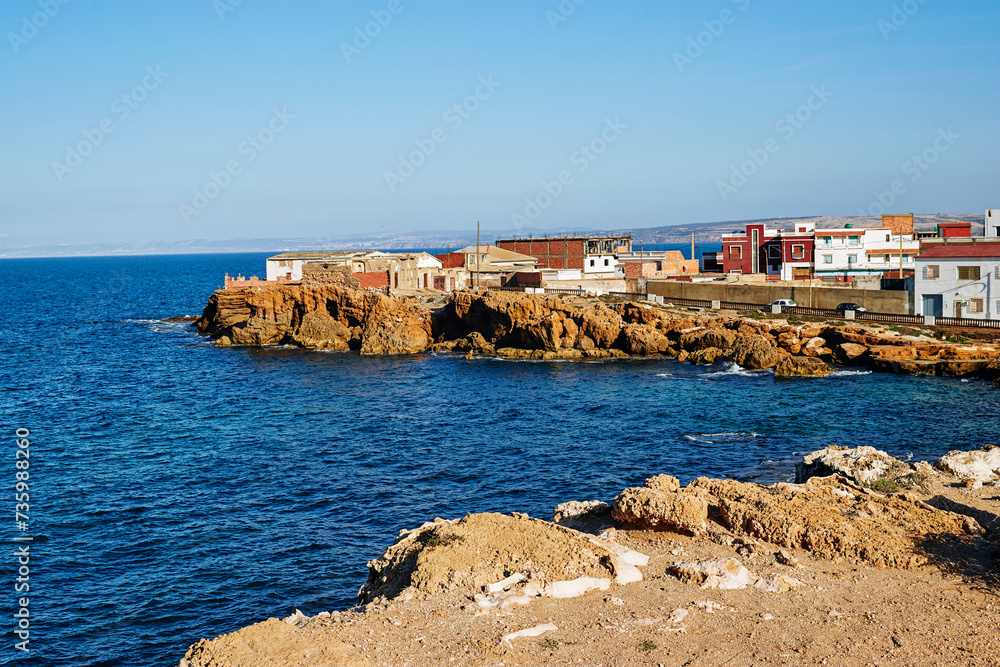 view of Oceanside beach houses in Algeria on the natural rock seawall