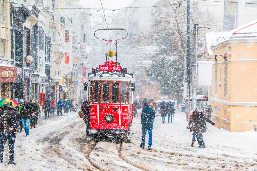 Fototapeta premium Istanbul, Turkey, 15 February 2021; Winter and Red Tram in Istiklal Street, Beyoglu, Istanbul.