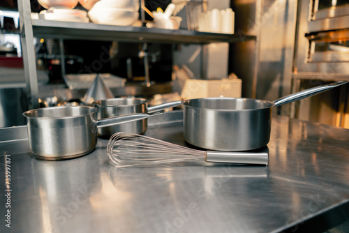 In the restaurant’s kitchen there are cook’s metal basins the shelf washed