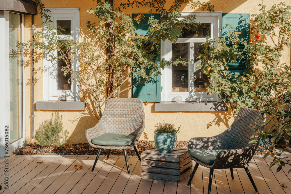 Fototapeta premium Garden Furniture For Leisure Time In Nature. Empty Chairs And Table Table In Orchard. Wooden Outdoor Furniture Set For Picnic In Autumn Garden. Cozy Interior Courtyard With Table And Chair In Village