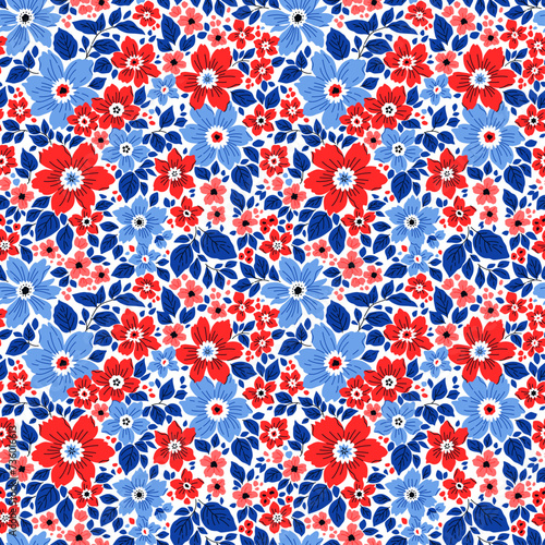 Vector seamless pattern. Vintage pattern in small flowers. Small red and blue flowers. White background. Ditsy floral background. Hand drawn flowers. Abstract contemporary modern trendy pattern.