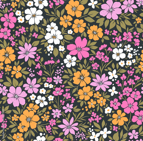 Retro floral pattern in small decorative flowers. Small pink, white, yellow flowers. Black background. Ditsy print. Floral seamless background ditsy pattern in small cute wild flowers.