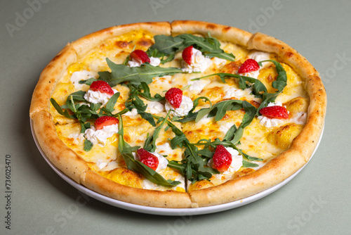 Freshly Baked Pizza with Strawberries, Cream Cheese, and Arugula on White Plate - Summer Party Theme