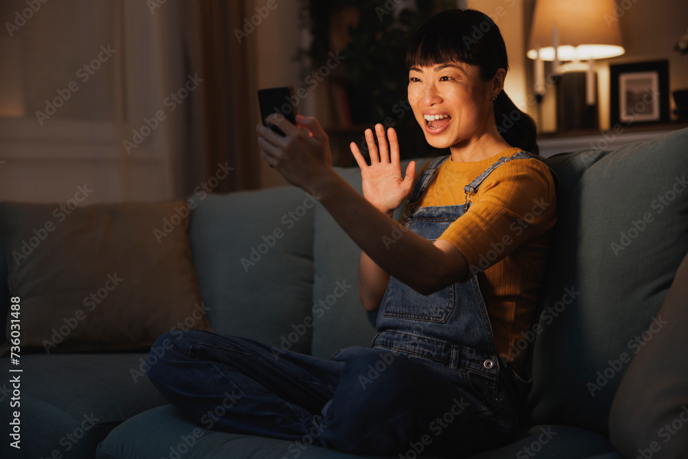 Woman having video call using smart phone Woman having video call using smart phone