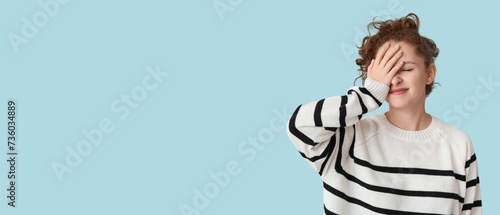 Quadro em tela Young woman doing facepalm on light blue background with space for text