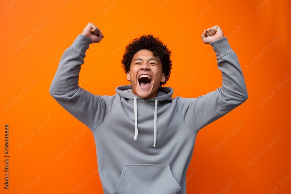 Joyful Man Celebrating Success in Orange
Joyful Man Celebrating Success in Orange