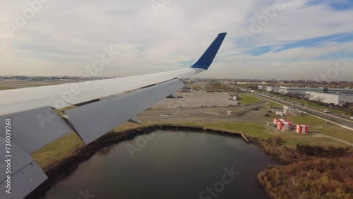 airplane wing view landing at new york john f kennedy airport usa generic commercial unmarked photo