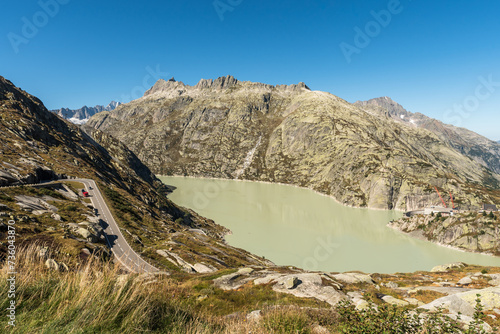 Grimsel Pass Road with view of Grimselsee lake, a reservoir in the Bernese Alps, Guttannen, Bernese Oberland, Canton of Bern, Switzerland photo