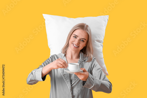 Happy young woman in pajama...