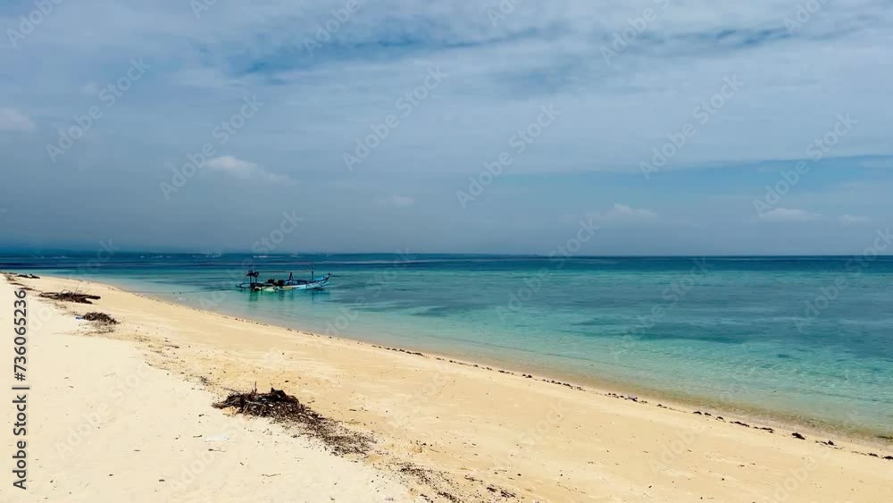 The beauty of the blue sea on Tabuhan Island in the Bali Strait, Indonesia.