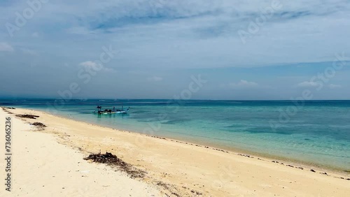 The beauty of the blue sea on Tabuhan Island in the Bali Strait, Indonesia. photo