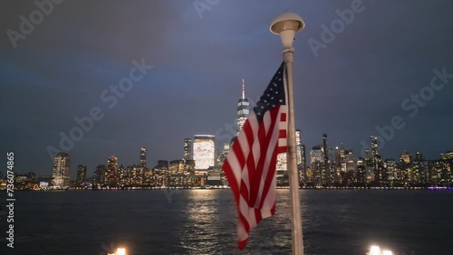 USA American flag. Memorial Day, Veteran's Day, July 4th. American Flag near New York City, Manhattan, Sunset. 4th of July with American flags, Independence Day. American flags waving against NYC.