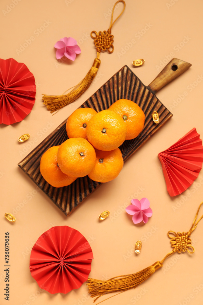 Mandarins and Chinese symbols on beige background. New Year celebration Mandarins and Chinese symbols on beige background. New Year celebration