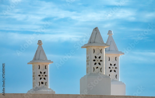 The beautiful Algarvian chimneys (Chaminé Algarvia), have becaome a symbol for the Algarve region of Portugal photo