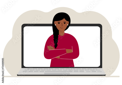 Woman communicates via videoconference through laptop screen. The concept of online meetings, webinars, remote work or work from home.
