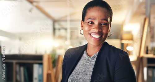 Face, happy and black woman in office at night for business on a computer during overtime. Smile, workspace and portrait of an African employee with a pc for a late deadline or working in corporate photo