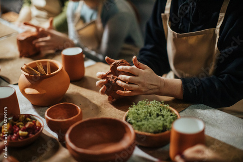 handmade clay potter making with hands photo