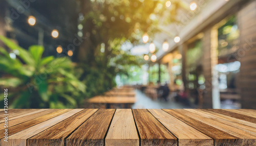 Wood table top on blurred interior blurred people meeting in coffee shop cafe co-working space Ready used us display or montage products design