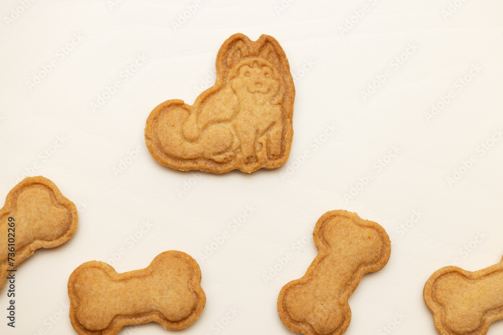 Fototapeta premium husky cookies and bone biscuits on the table. Copy space