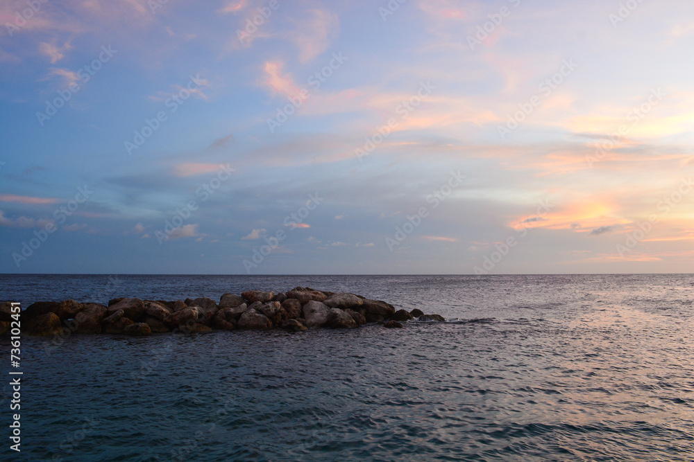 Scenic view of sun setting and bright horizon in Caribbean sea.