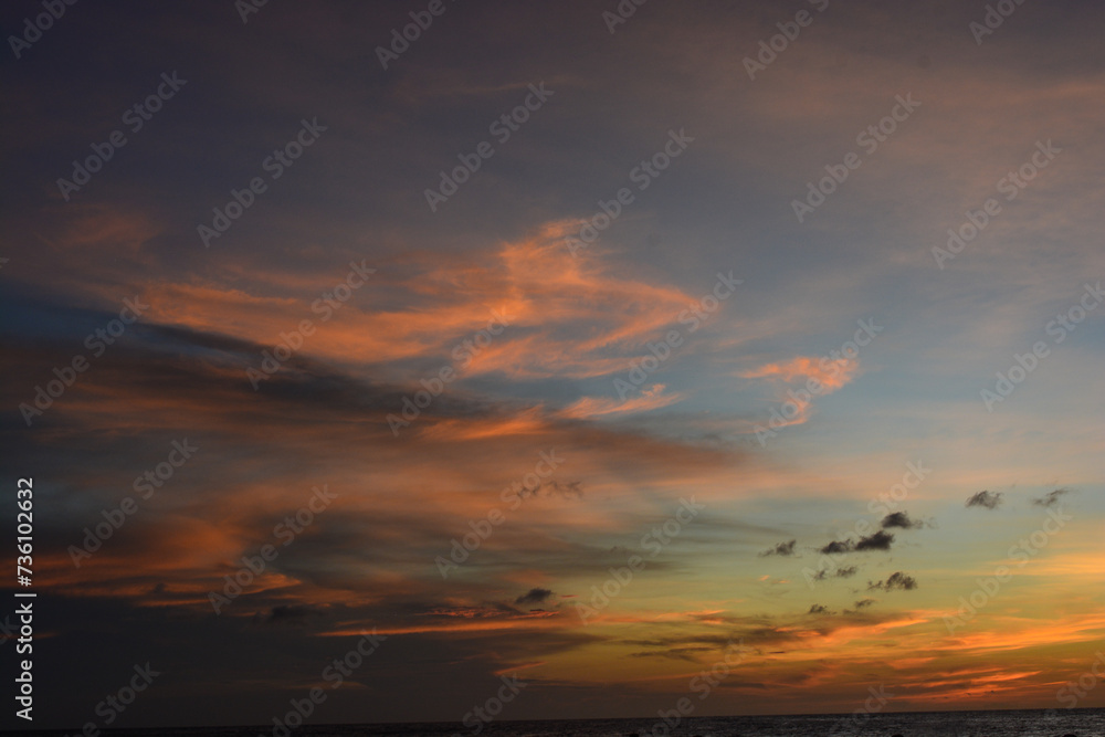 Scenic view of colourful sky during sun setting in Caribbean sea.