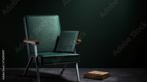 The holy Quran with green cover on gray chair.