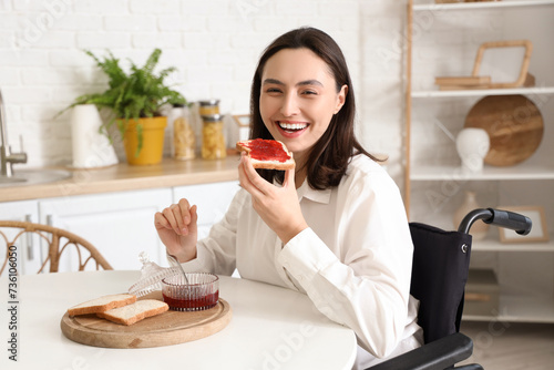 Happy young woman in wheelc...