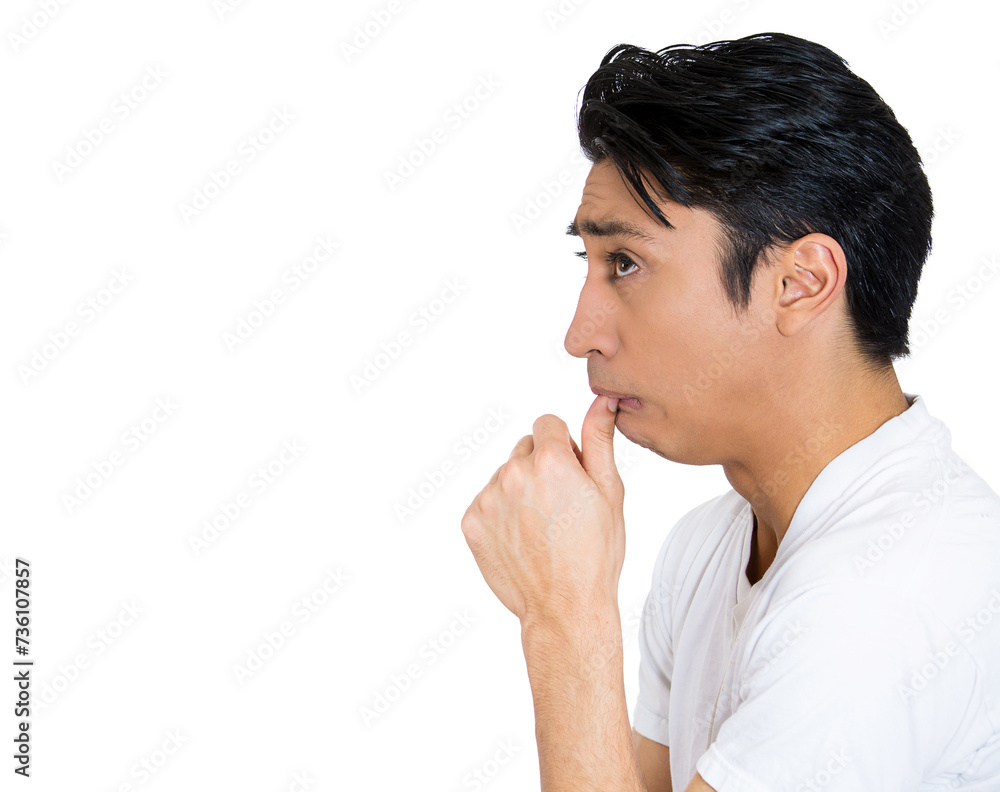 Closeup portrait young man, student with finger in mouth, sucking thumb, biting fingernail in stress, deep thought, confused, isolated on white background. Closeup portrait young man, student with finger in mouth, sucking thumb, biting fingernail in stress, deep thought, confused, isolated on white background.
