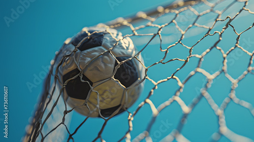 Soccer Ball in Net on Sunny Day